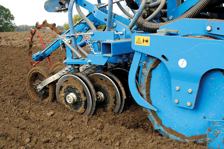 double disc coulter with a rubber-tyred depth control wheel 